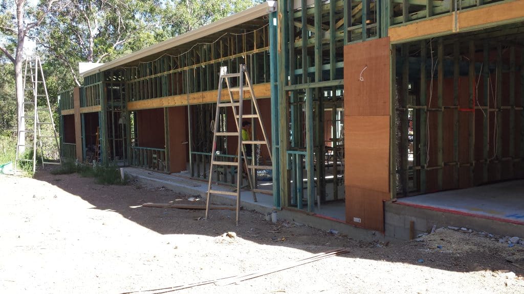The frame of a modern flat roof house constructed with timber framing. 
Build your own architectural home. Self Build Australia